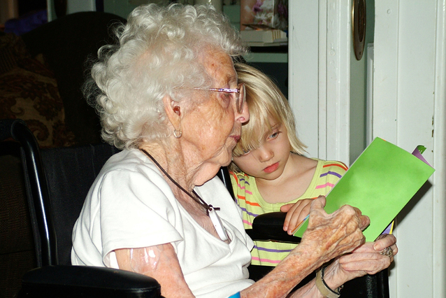 reading-with-grandmother-in-wheelchair-1432646-638x425